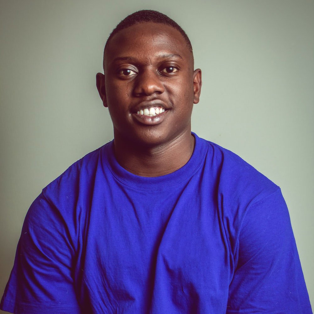 Man smiling in a blue shirt